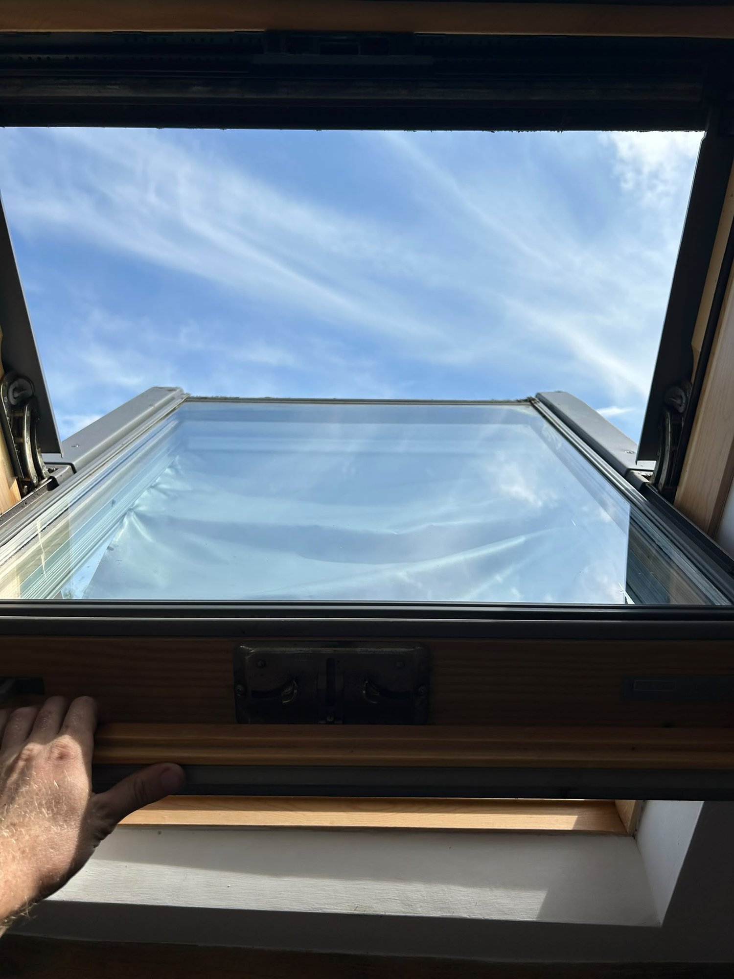 The same skylight cleaned, glass clear and frame wiped
