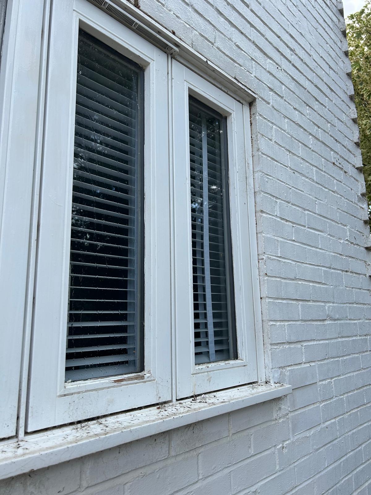 Window before cleaning, dirty glass and frames