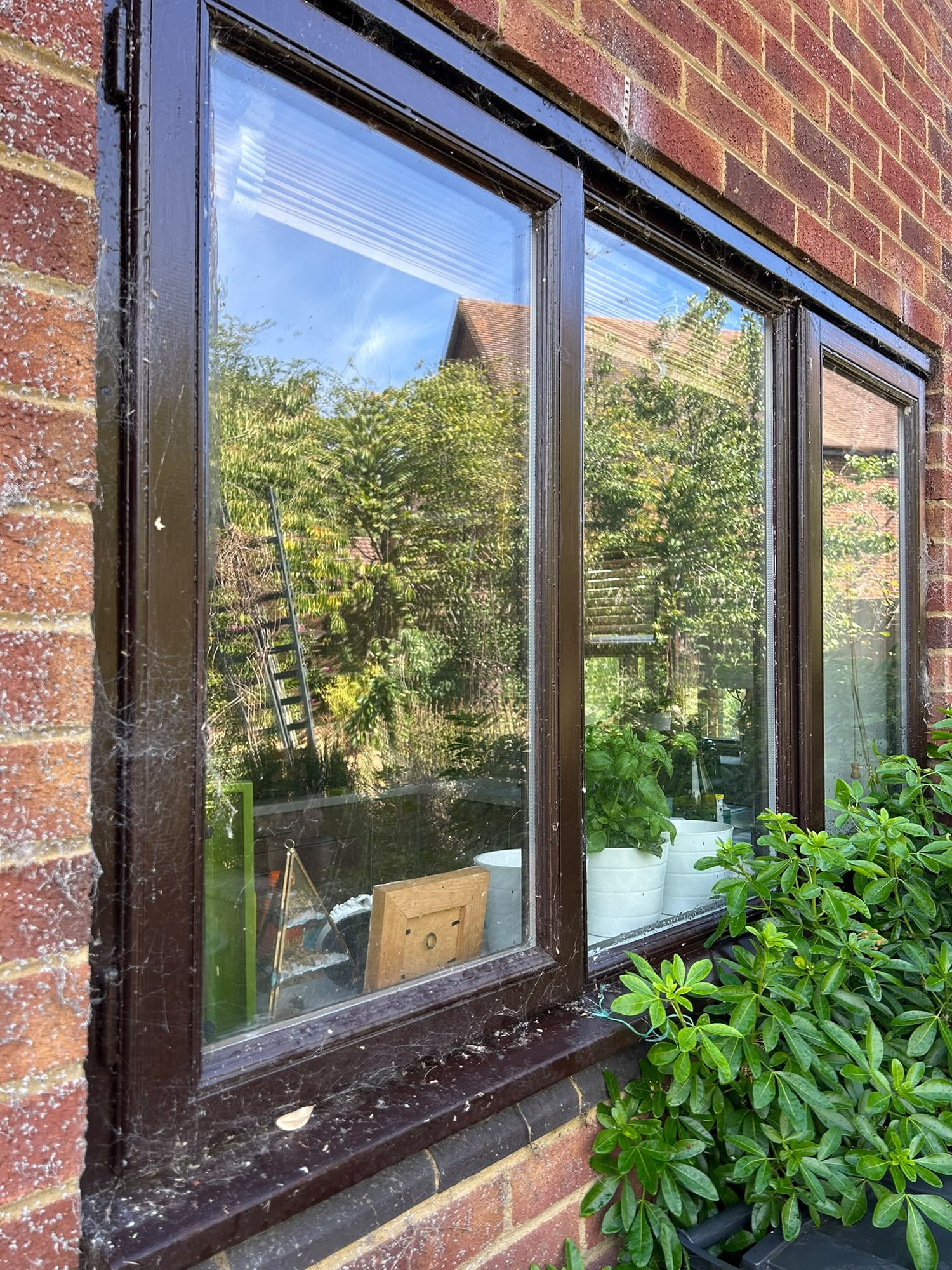 Window before cleaning, dirty glass and frames